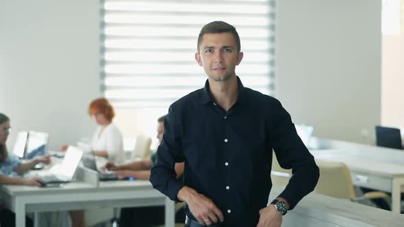 Confident Happy Office Worker Looking at Camera in Modern Office, Positive Male Employee 