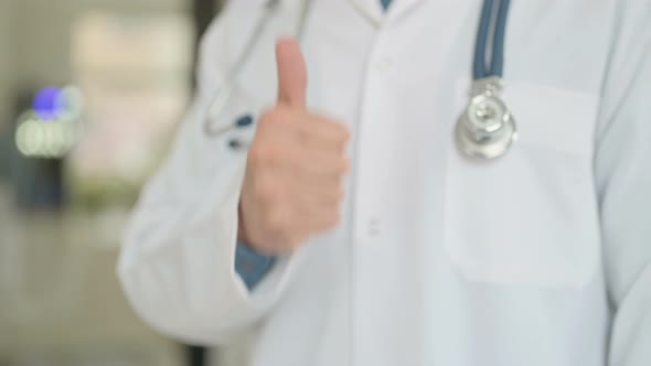 Old Doctor Showing Thumbs Up Sign
