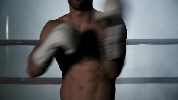 Boxer Puts on Boxing Gloves