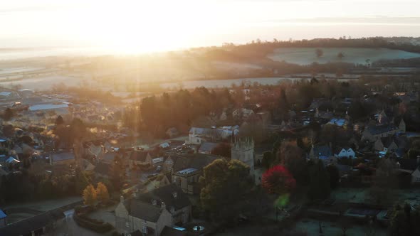 Aerial drone video of Typical English village and beautiful British countryside scenery in The Cotsw