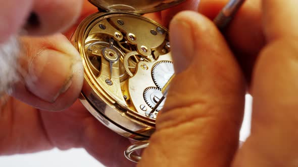 Horologist repairing a pocket watch