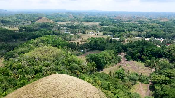 wide aerial view of landscape by the Chocolate Hills viewing complex, Bohol, Philippines