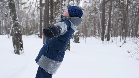 a Child Fall in the Snow in Slowmotion