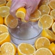 Woman squeezing fresh lemons - VideoHive Item for Sale