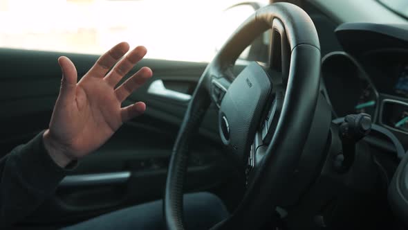 Man Driving in Innovative Automated Car Using Selfparking Autopilot for Parking on Parking Lot