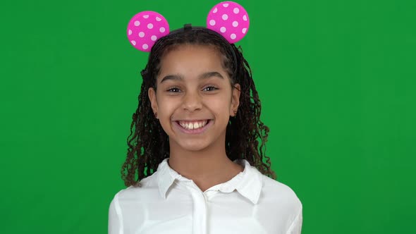 Excited Happy Cheerful African American Teen Girl Wearing Mouse Toy Ears Blowing Party Whistle