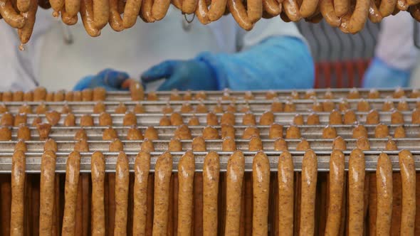 Fresh Sausages Are Placed On Racks In A Meat Processing Factory