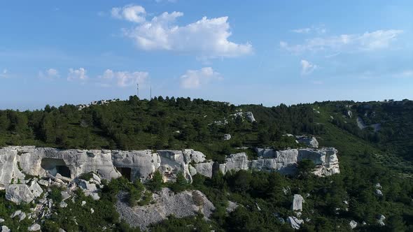 Cave dwellings of the Alpilles massif in France seen from the sky