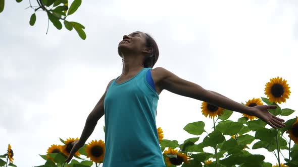 Beautiful woman raising hand in the air. Freedom Happy Time.