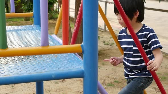 Asian Child Playing On Playground In Summer Outdoor Park Slow Motion