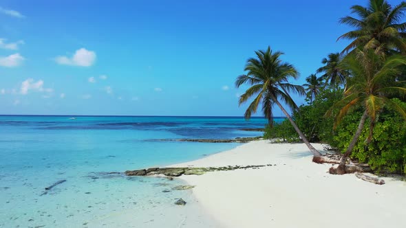 Luxury overhead travel shot of a summer white paradise sand beach and aqua blue ocean background in 