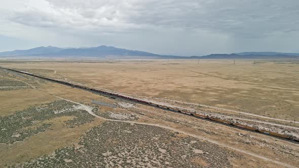 Aerial view of train tracks stretching through the Utah desert