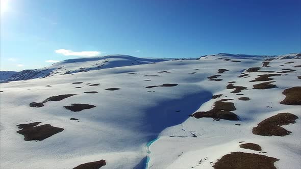 Panning aerial view of mountain pass Aurlandsfjellet in Norway.