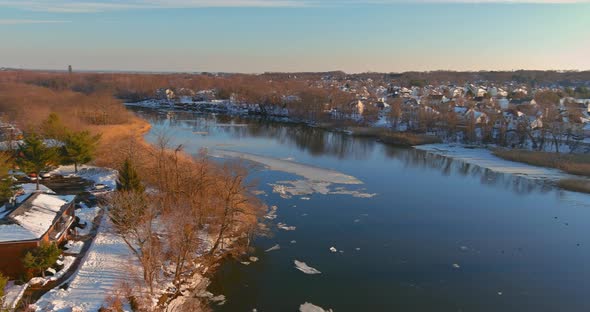 Landscape view the shore the river floating ice drifting floes on view of the small town