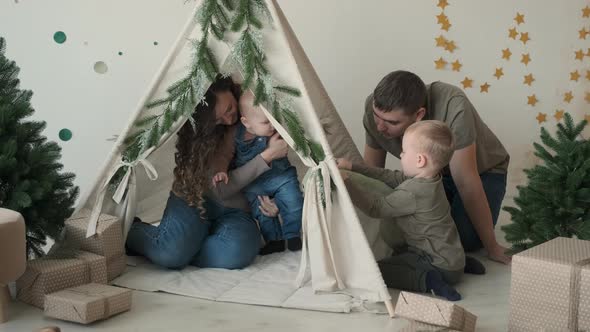 Family Playing in Toy Tent on Christmas Day