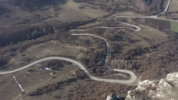 Endless valley with curvy road 4K drone footage