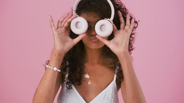 Young Afroamerican Model in Sunglasses White Dress