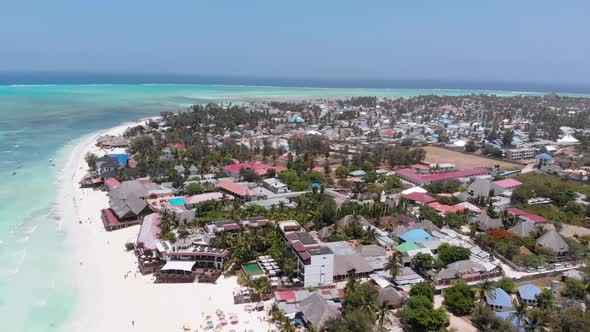 Aerial Coastline of Paradise Beach and Clear Water Over Reef in Ocean Zanzibar