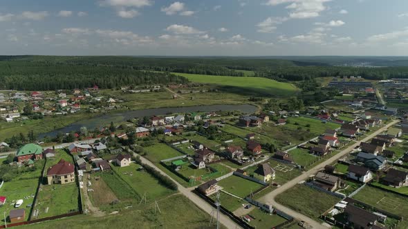 Aerial view of Pond in the village located among fields and forests 20