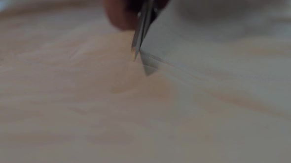 Dressmaker cutting material