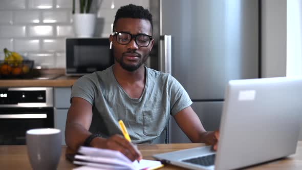 An AfricanAmerican Guy at Home Office