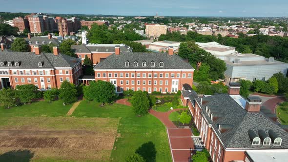 Brick buildings on campus of Johns Hopkins University grounds. Aerial approach.