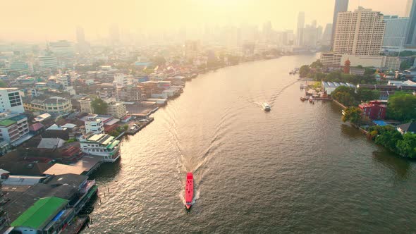 4K : Aerial view of passenger boats moving in Chao Phraya River