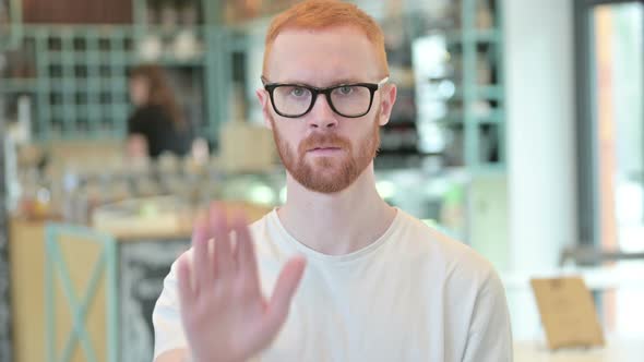 Portrait of Stop Sign By Strict Redhead Man 