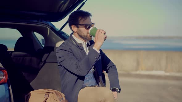 Businessman In Sunglasses. an Drink Coffee And Relaxing After Work.  Italian Man Looking At River.