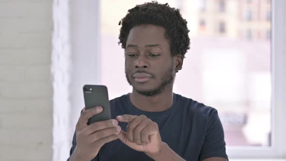 African Man Using Smartphone