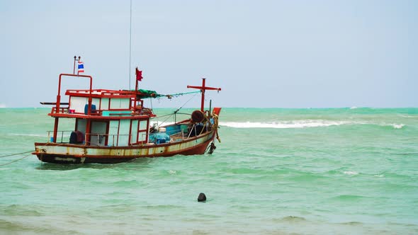 Motor Boat Swings on Waves in The Sea