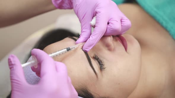 Receiving mesotherapy procedure, cosmetology. Skincare concept.