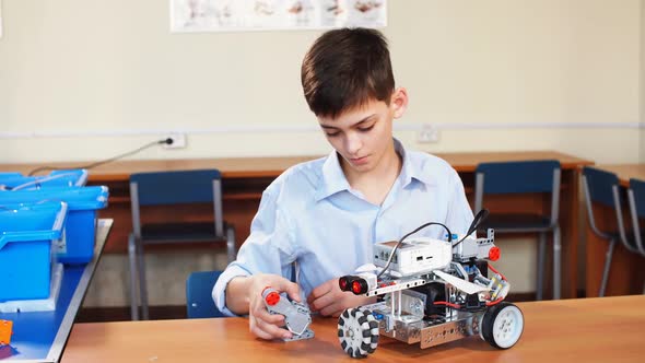 Little Boy in Robotics School Makes Robot