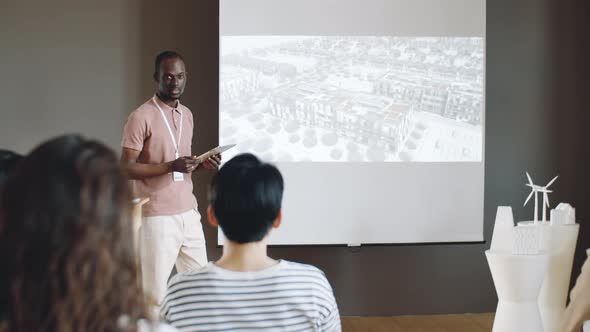 African American Architect Giving Presentation on Conference
