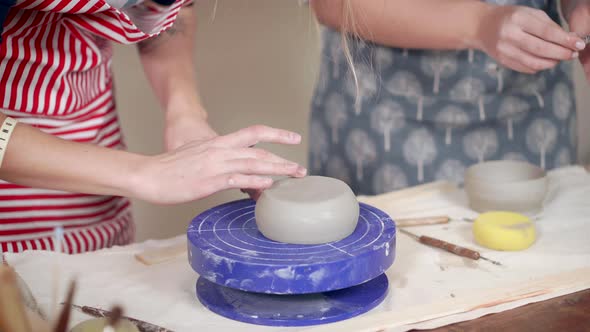 Female Potters on a Pottery Lesson in Class
