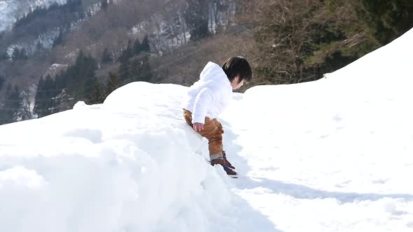 Cute Asian Child Playing Snow Outdoors Slow Motion