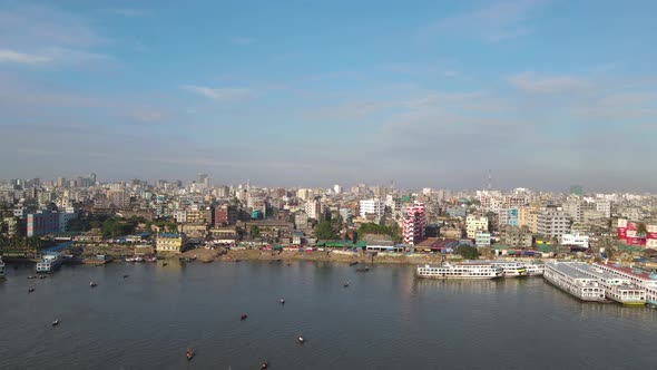 aerial wide view of Dhaka cityscape by Buriganga river bank. Bangladesh, Asia