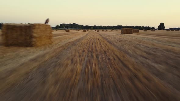 Flying Over a Field with Bales