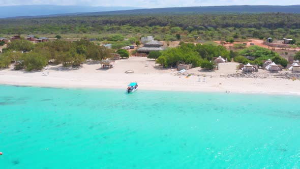 Aerial shot over turquoise waters at Eco Del Mar campsite beach, Pedernales. Dominican Republic