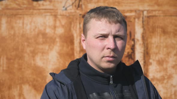 Portrait of Adult Man Standing at City Street with Positive Emotions and Feelings on His Face. Guy