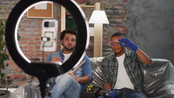 Joyful Black Guys Handymen Talk to Followers Shooting Vlog