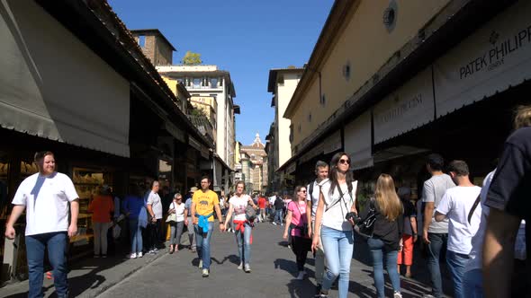 Walking on Ponte Vecchio Bridge in Florence Italy