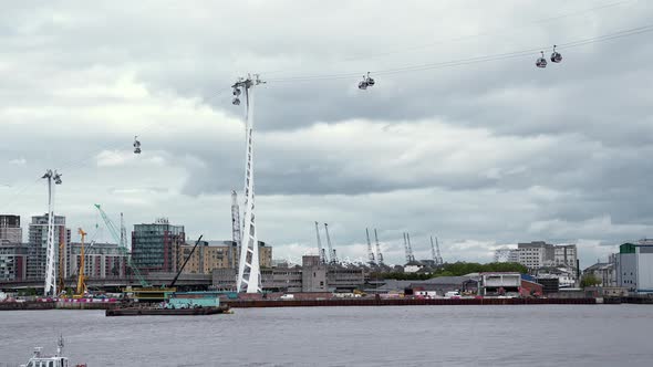 View of the Emirates Air Line Cable Car Cabins Over the River Thames