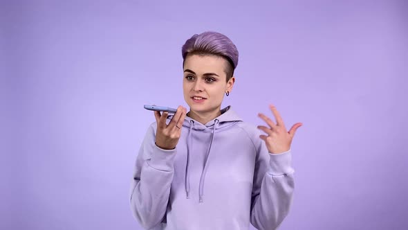 Young Woman in Purple Using Speakerphone Sending Audio Voice Message