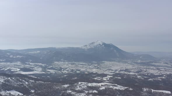 Winter scene with mountain Rtanj in background 4K aerial footage