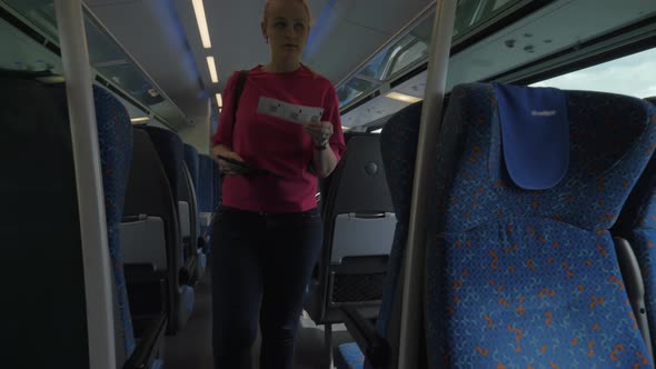 Shot of Young Blond Woman Going Along Train and Searching Her Seat Place, Modern Rail Train, Vienna