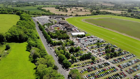 Rows of multi colored cars parked at an Irish Country Fair