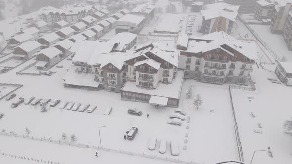 Flying over mountain resort Crystal in Bakuriani. Snowy winter day. Georgia