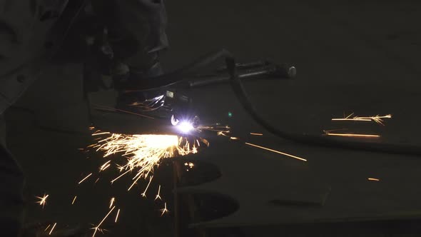 Industry Worker in Protective Uniform Cutting Metal Manually