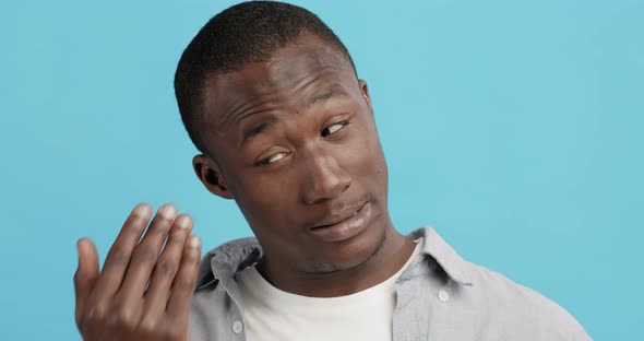 Black Man Rubbing His Eye, Getting Away Eyewinker